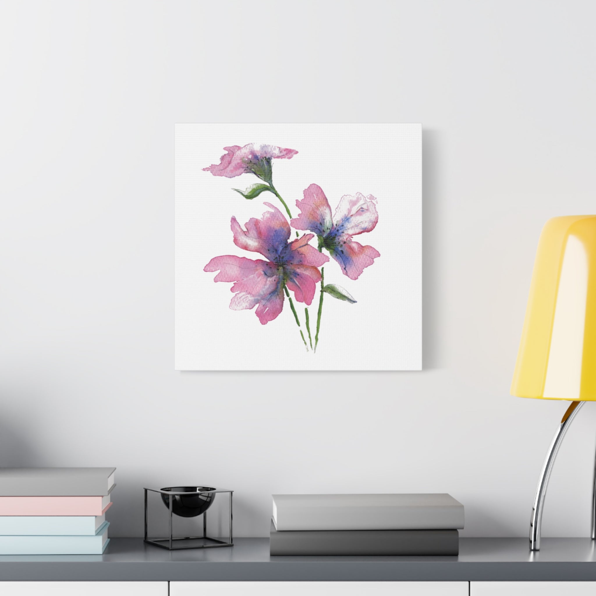 A Gentle Bloom floral canvas showing soft painterly texture in a study setting with lamp
