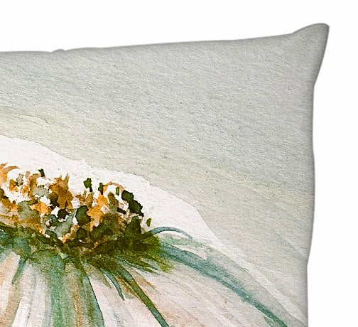 Decorative pillow with floral design on a white background close up of corner