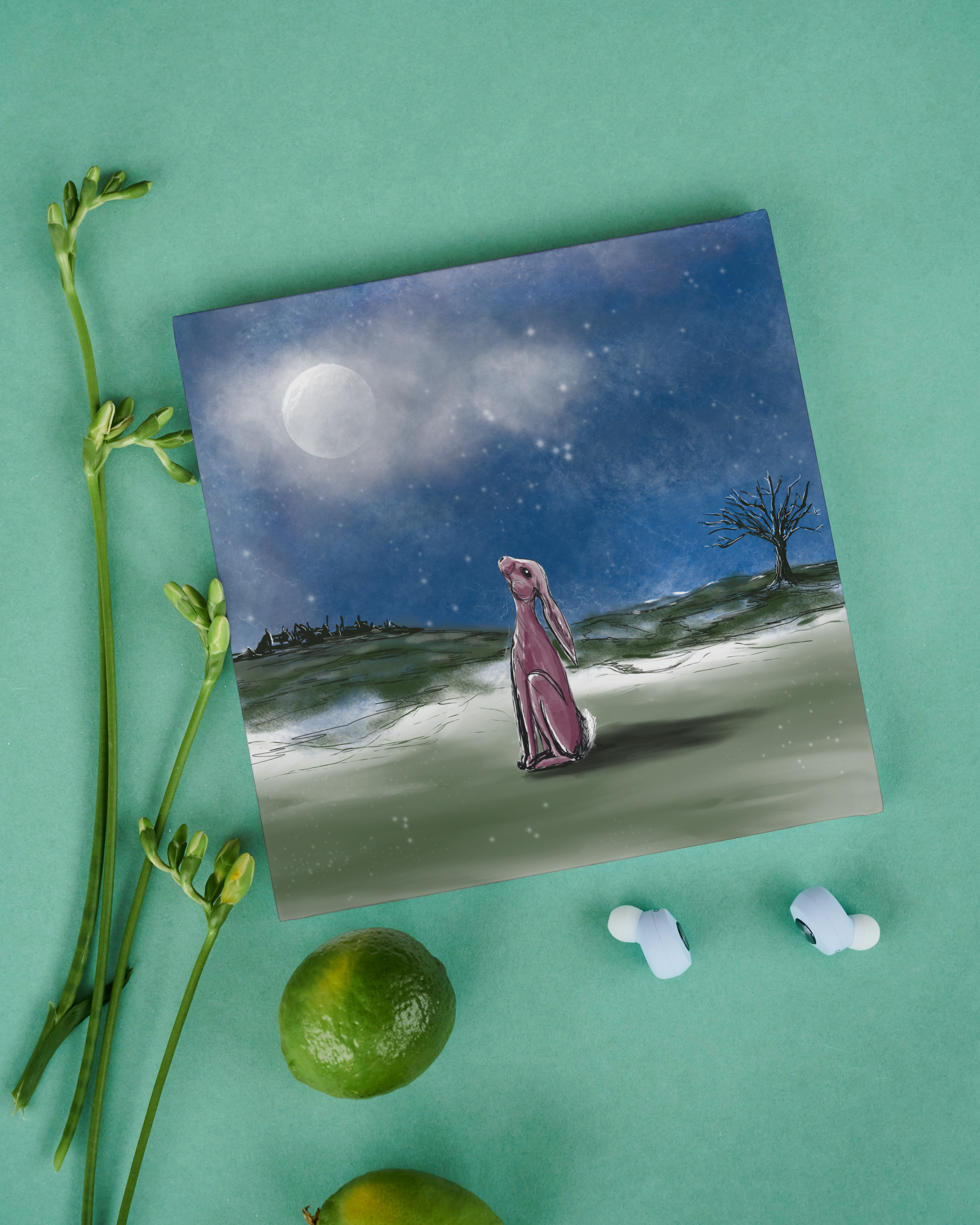 Stargaser hare card night time scene, on a green table top with flowers and limes