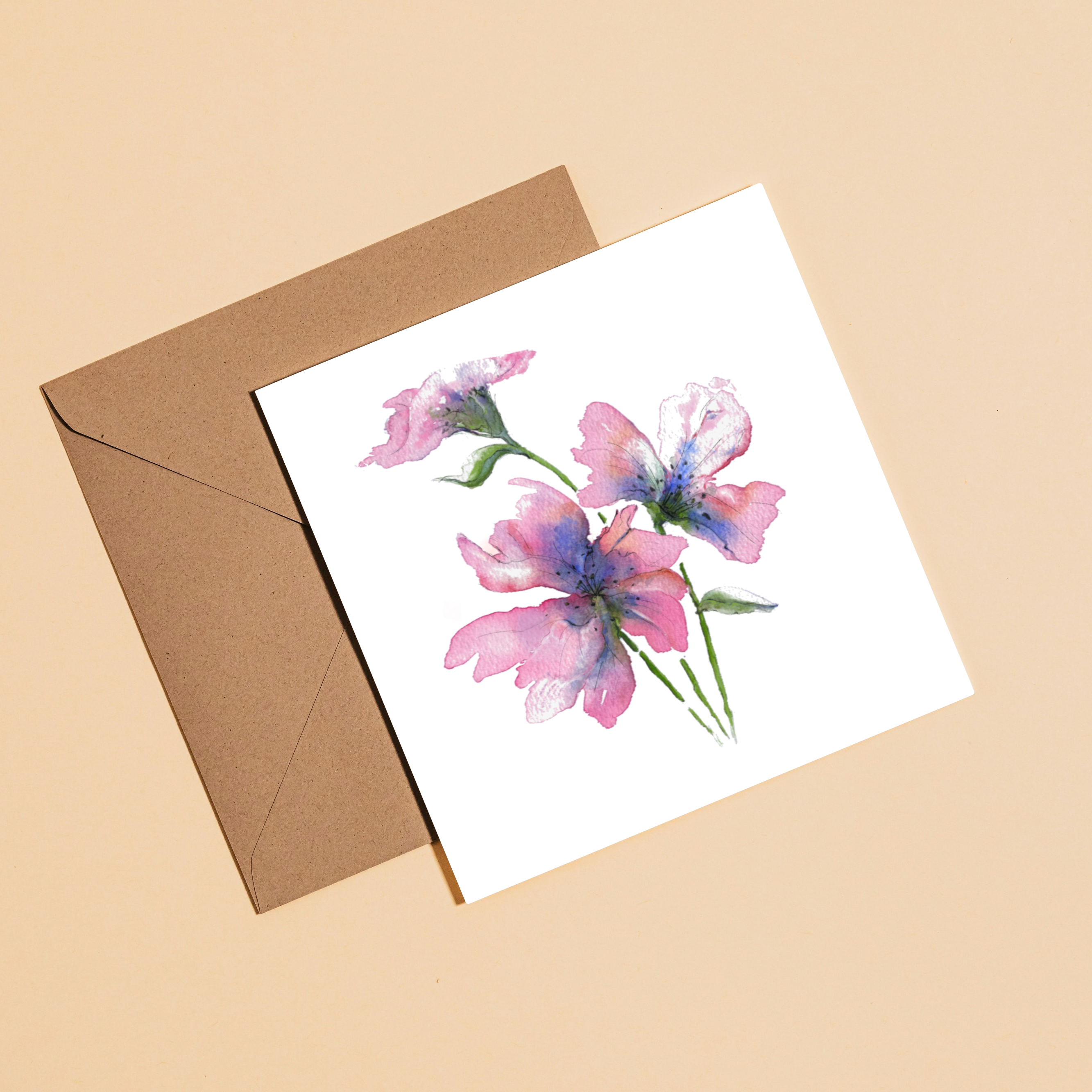 Floral card with a brown envelope on a beige background