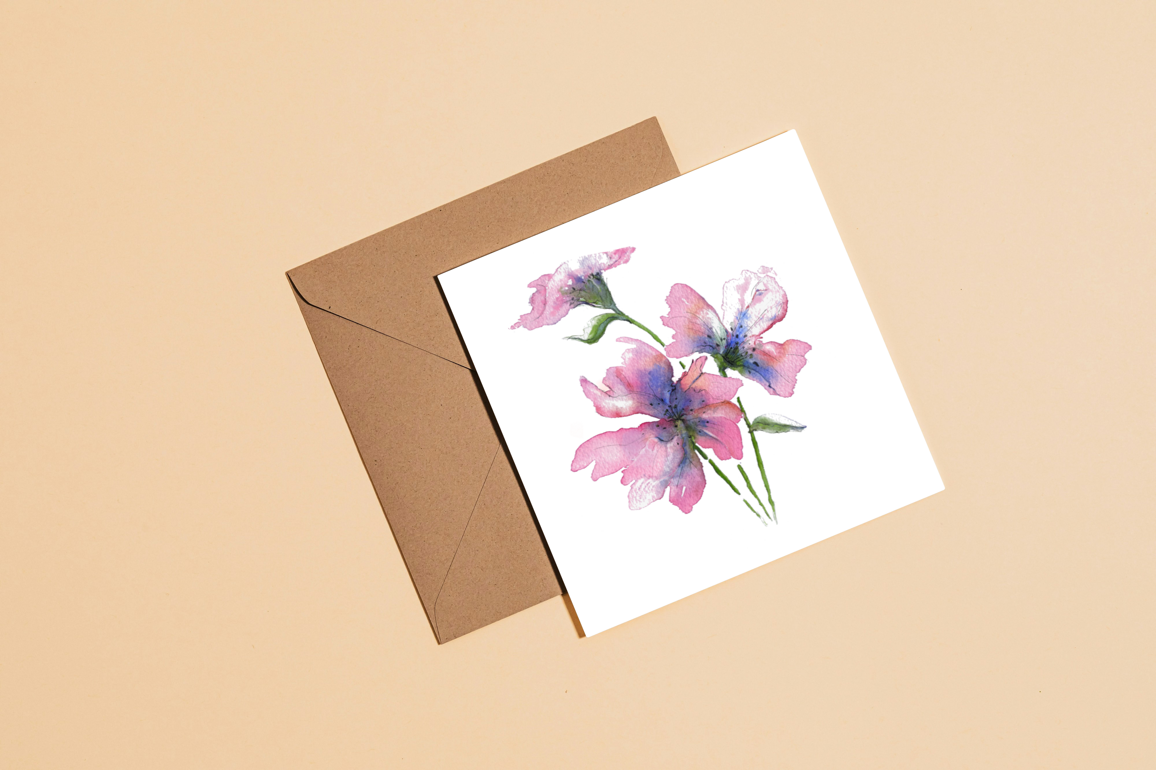 Floral card with a brown envelope on a beige background