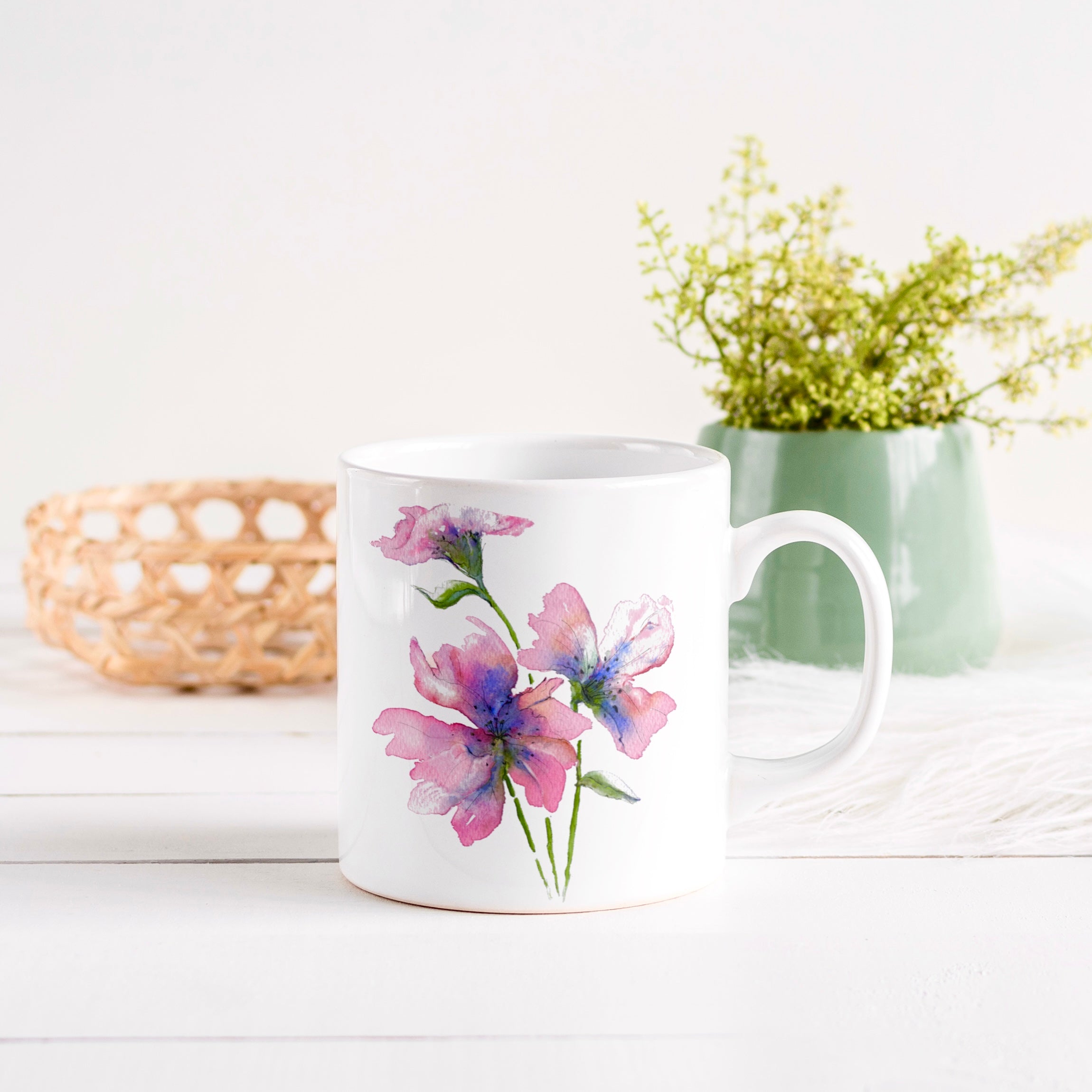 A Gentle Bloom watercolour floral mug — lifestyle shot with soft pink botanical detail